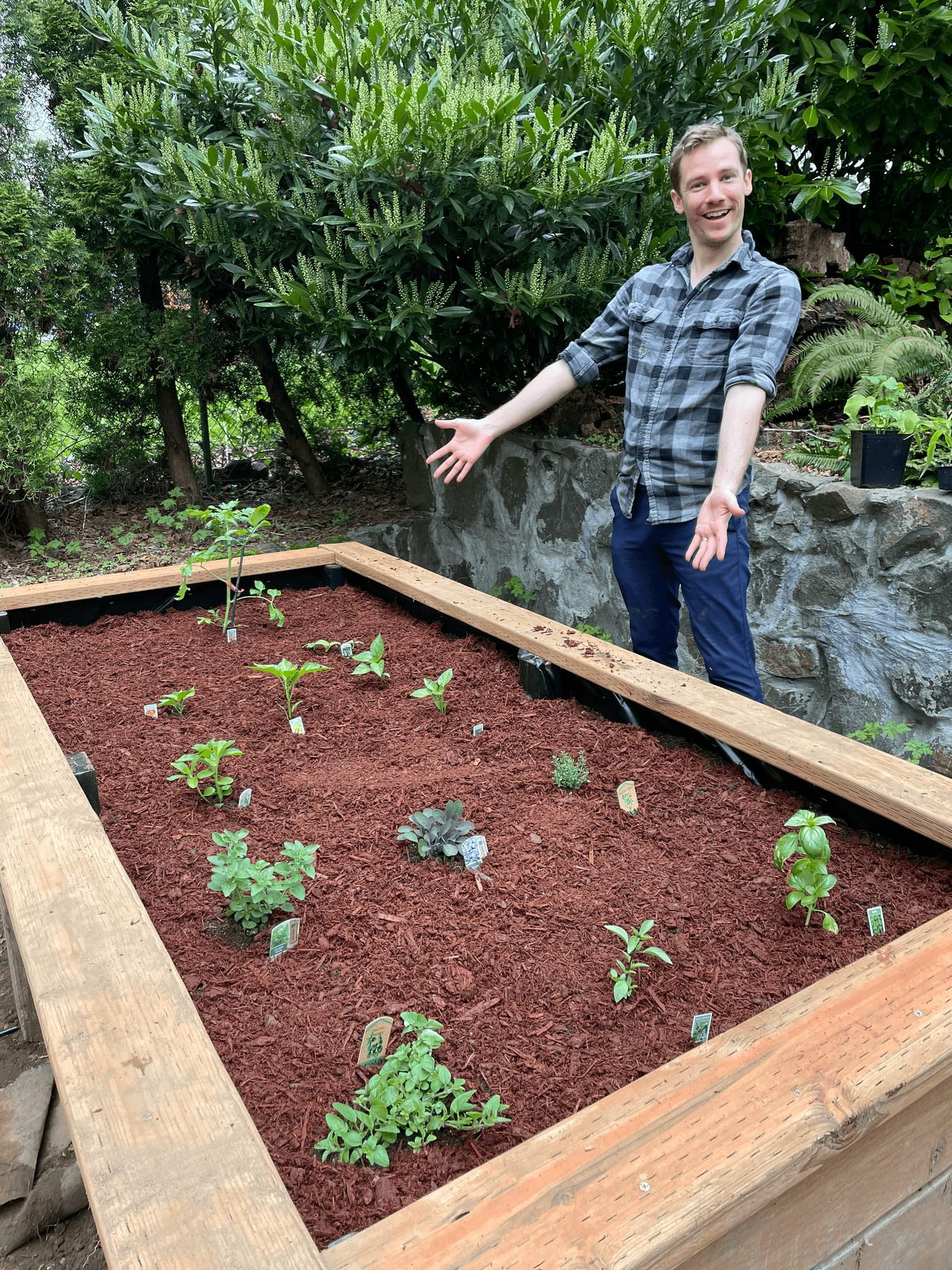 Nate Bauer showcasing his newly planted garden